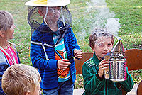 Excited children learning about beekeeping